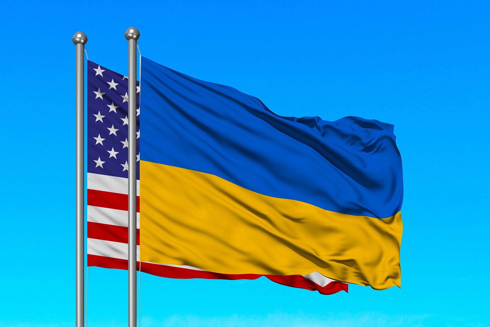 United States Flag and Ukrainian Flag Flying on a Flag Pole