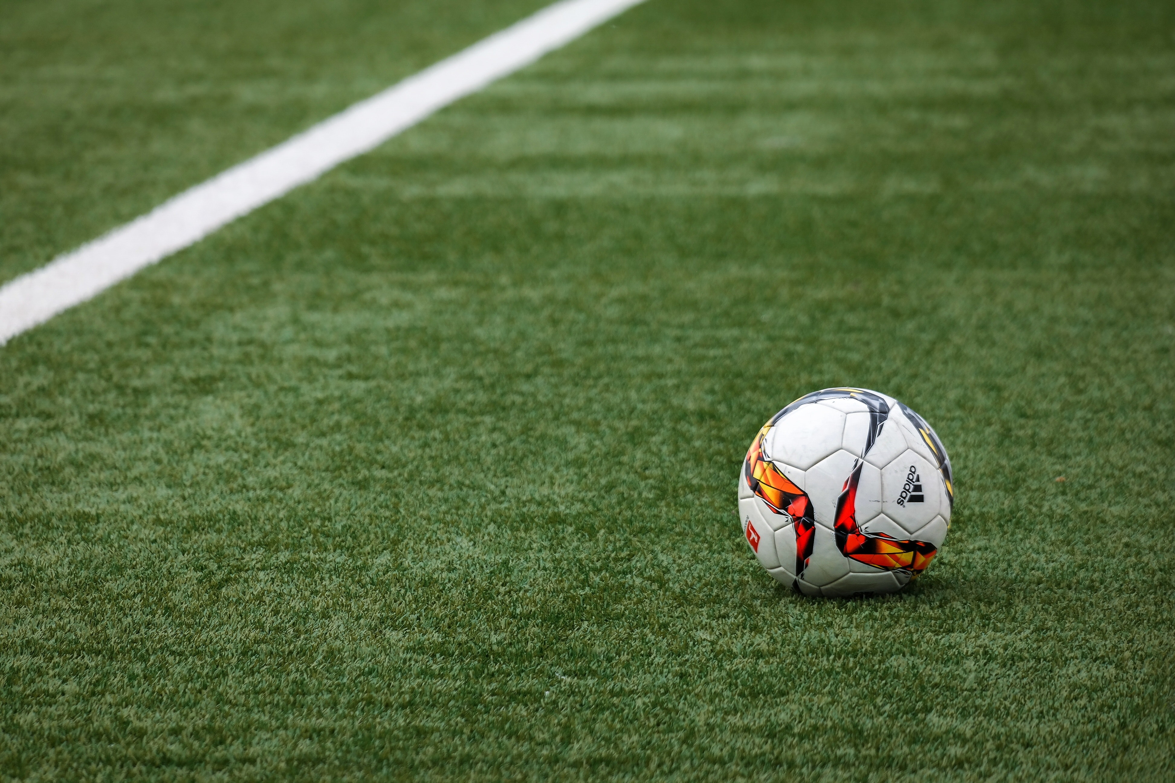 Soccer ball on a field of green grass