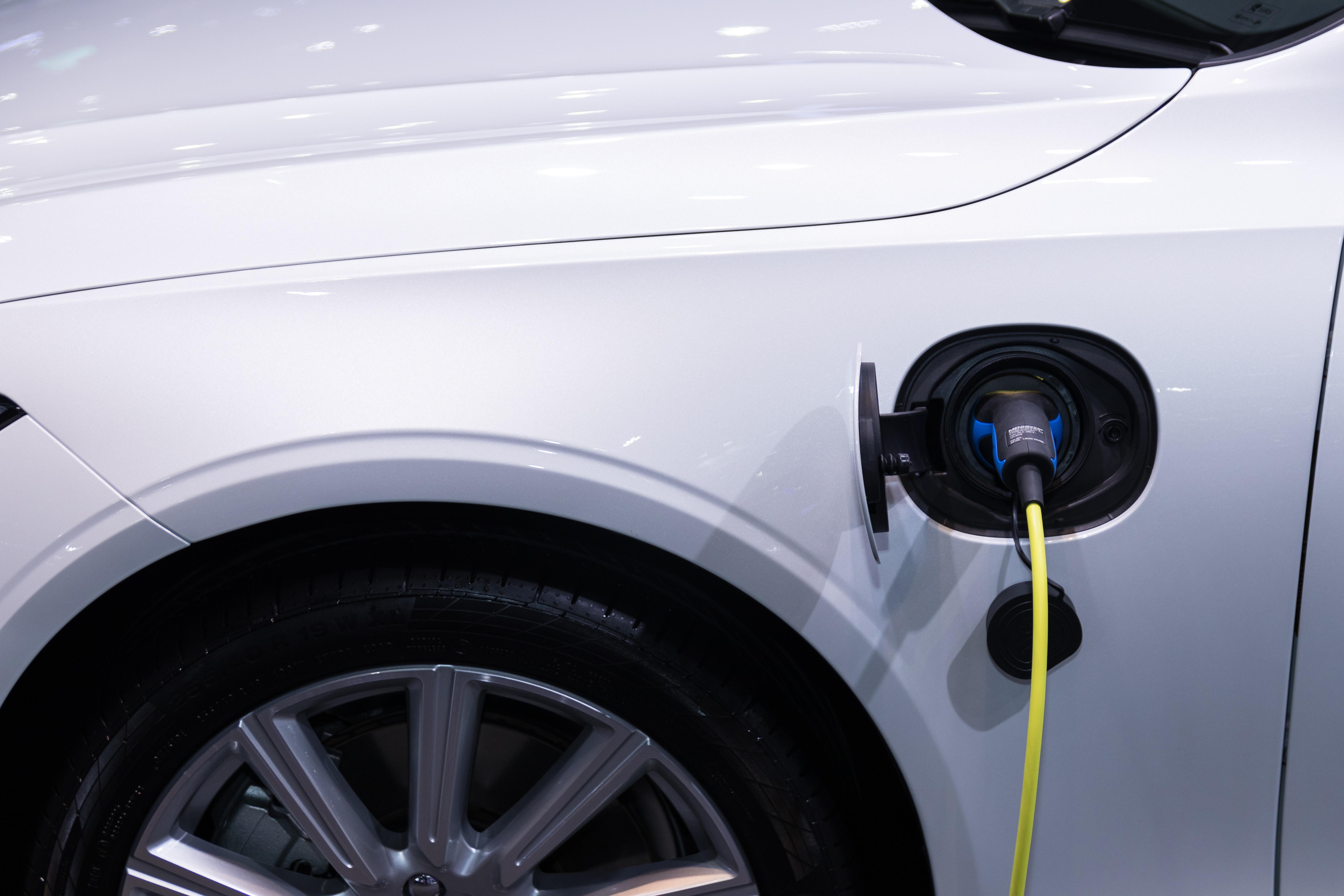 Close up of white electric vehicle charging