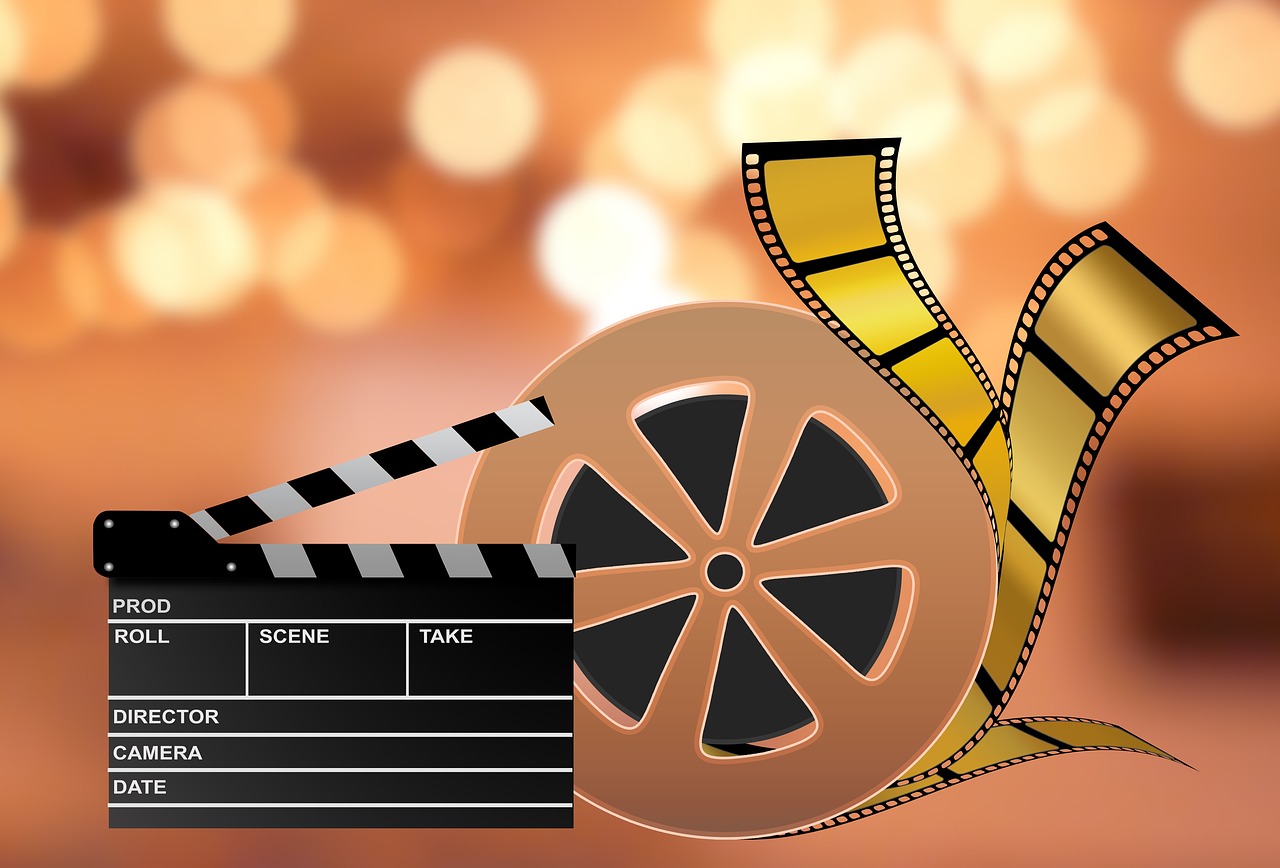 animated movie film reel and director's clapperboard