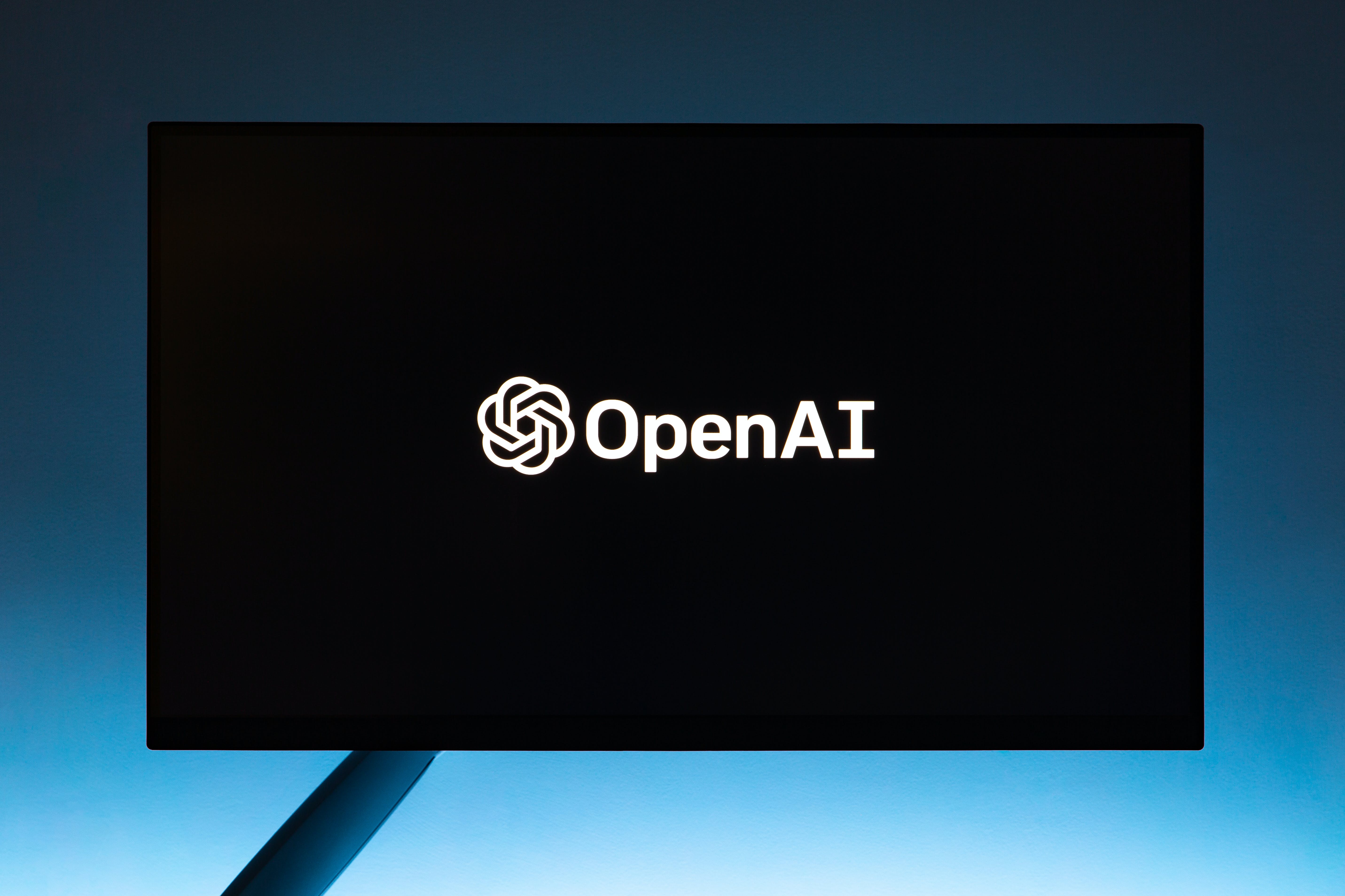 OpenAI logo on a black computer monitor