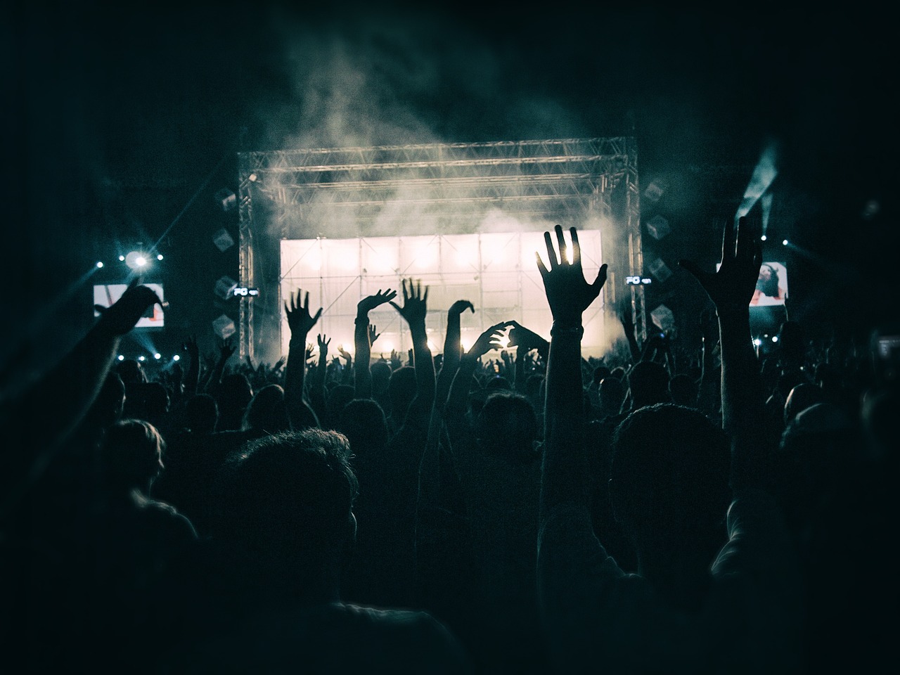 file image of fans in front of a concert stage