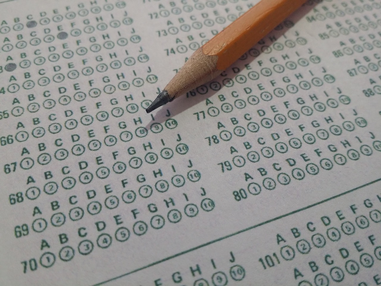 close up of a bubble sheet for standardized testing with a pencil
