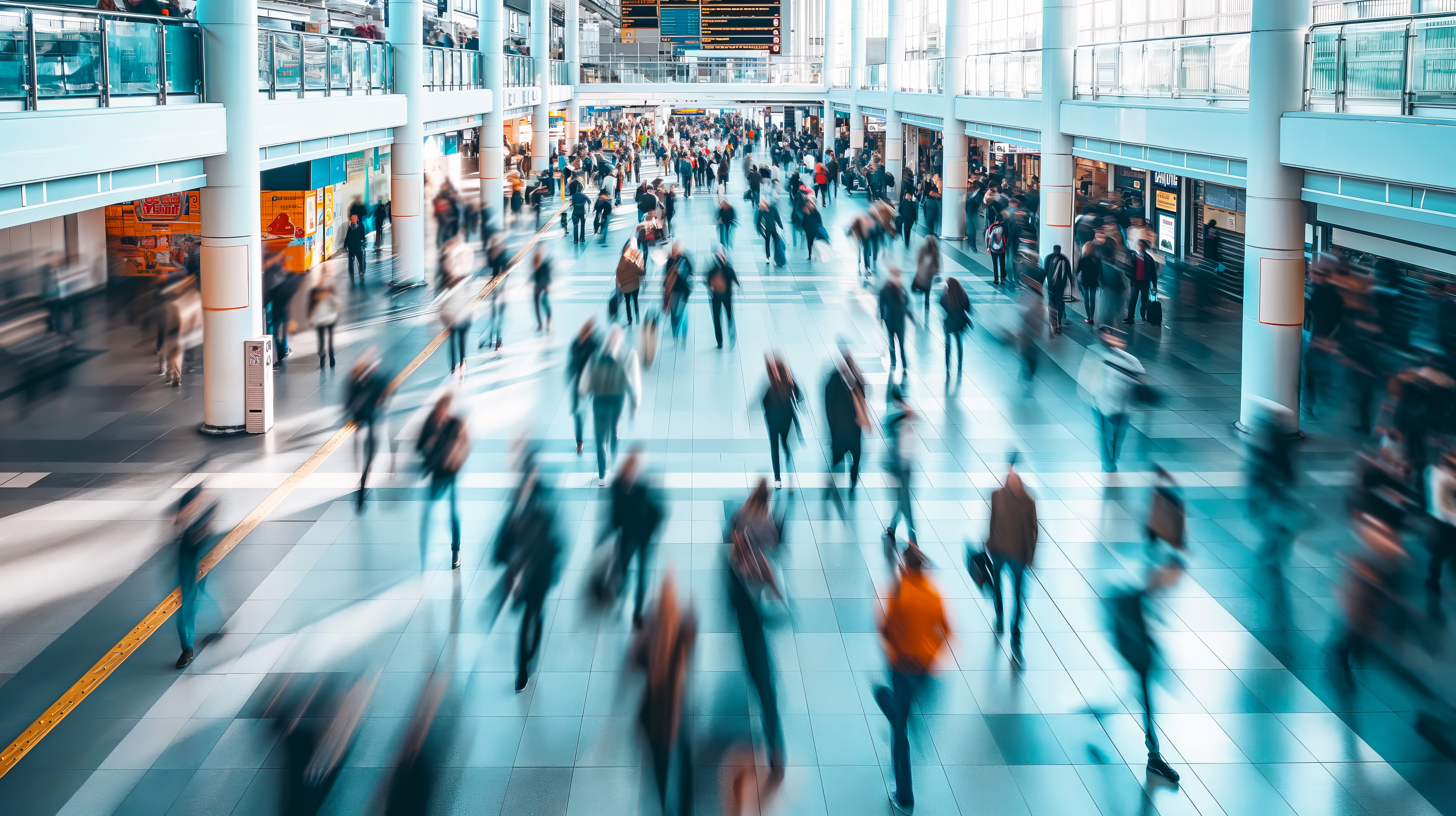 blurred image of people walking in an airport terminal