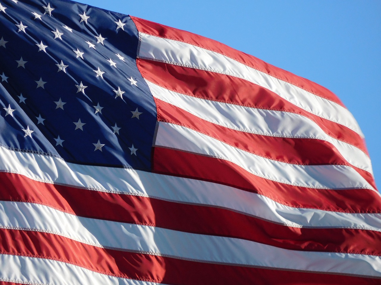 American Flag with a blue sky background