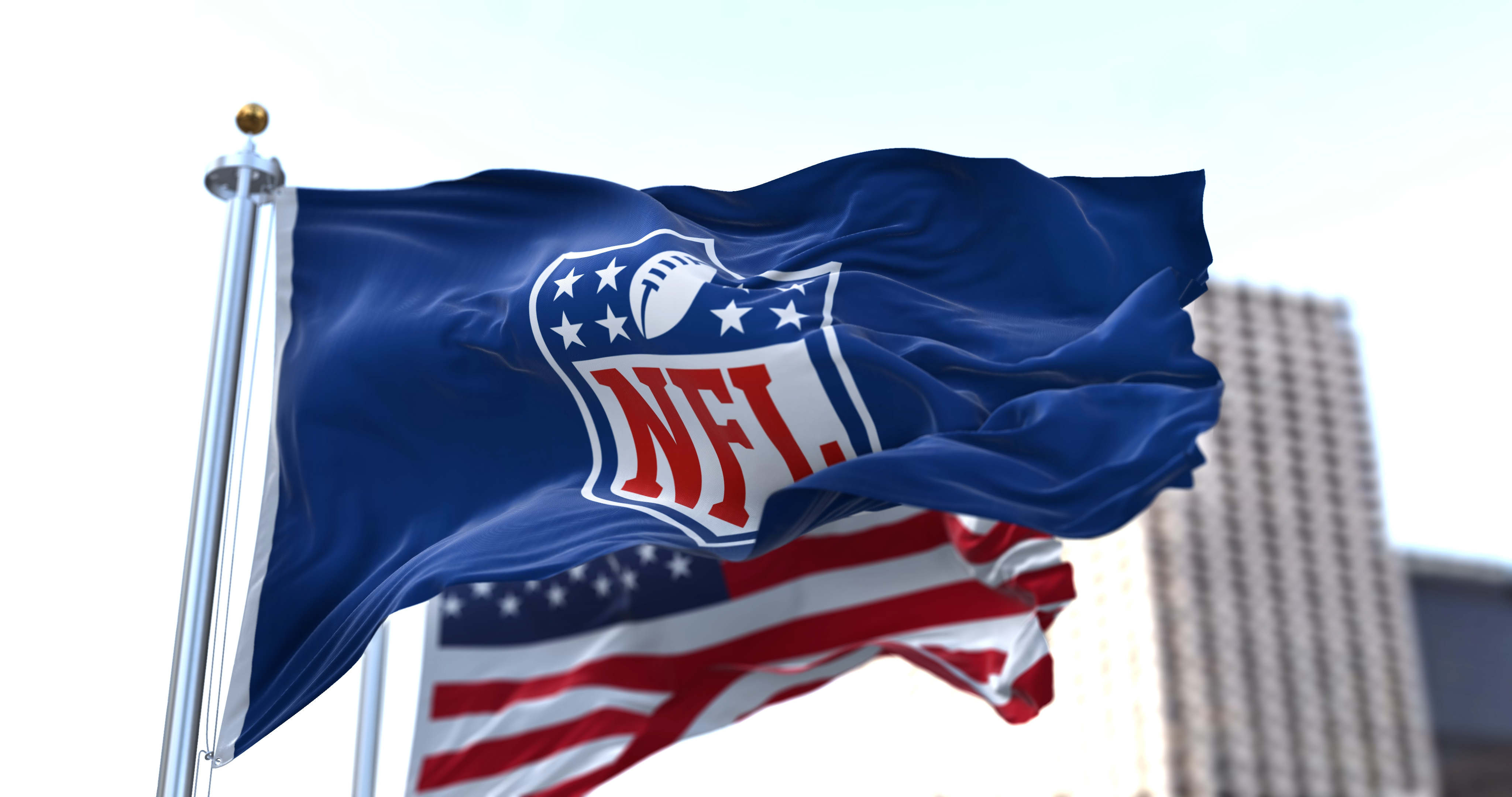 NFL and US flag waving in the wind