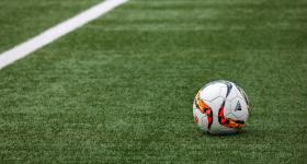 Soccer ball on a field of green grass