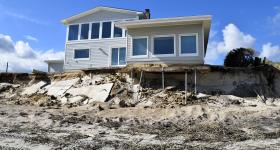 Home on a beach that's held up by stilts and impacted by beach erosion