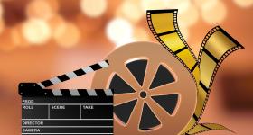 animated movie film reel and director's clapperboard