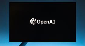 OpenAI logo on a black computer monitor