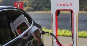 Tesla Plugged into a Charging Station