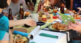 friends gathering around a dinner table 