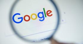 magnifying glass hovering over Google search bar