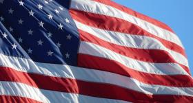 American Flag with a blue sky background