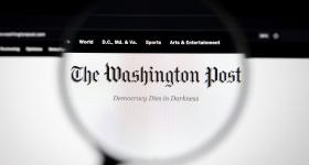 Magnifying glass hovering over Washington Post newspaper logo