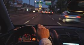 View from a steering wheel driving on a road